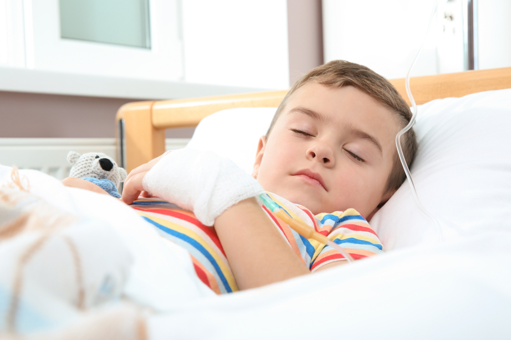 Little,Child,With,Intravenous,Drip,Sleeping,In,Hospital,Bed