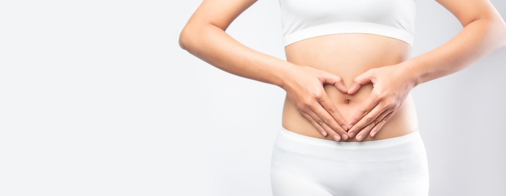 Close,Up,Woman,Hands,Made,Heart,On,Belly,Isolated,On