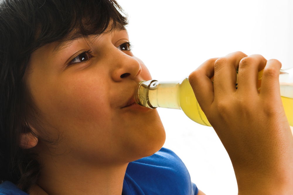 Boy,Drinking,A,Soft-drink,Out,Of,A,Bottle