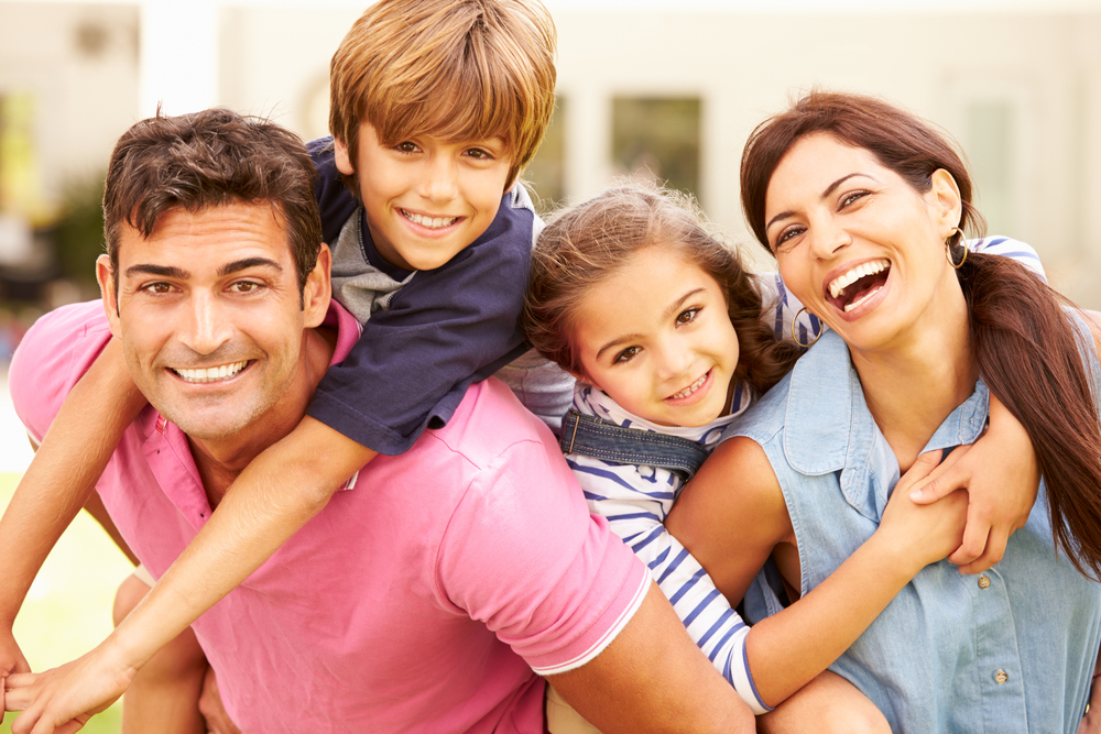 Portrait,Of,Happy,Family,In,Garden,At,Home