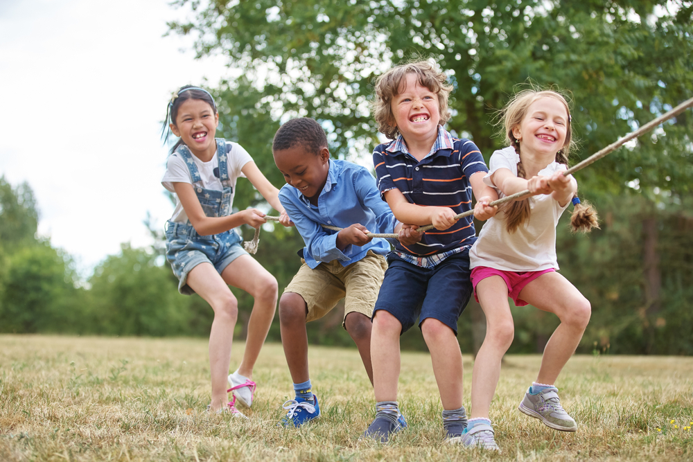 Interracial,Group,Of,Kids,Playing,At,The,Park