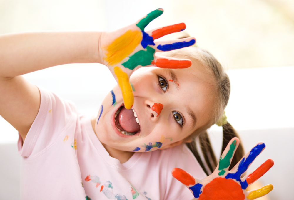 Portrait,Of,A,Cute,Cheerful,Girl,Showing,Her,Hands,Painted