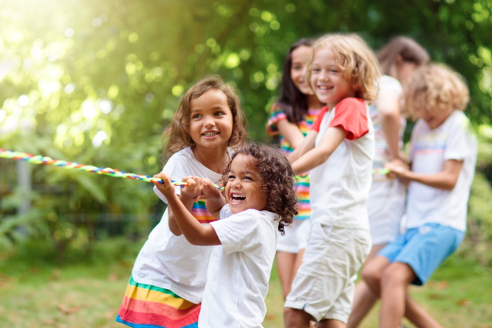 Kids,Play,Tug,Of,War,In,Sunny,Park.,Summer,Outdoor