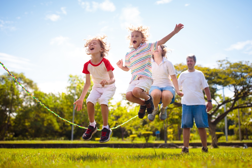 Happy,Kids,Play,Outdoor.,Children,Skipping,Rope,In,Sunny,Garden.