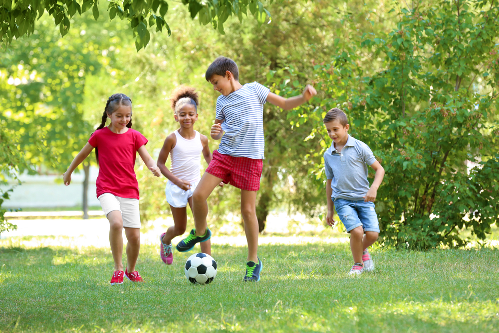 Cute,Children,Playing,Football,In,Park