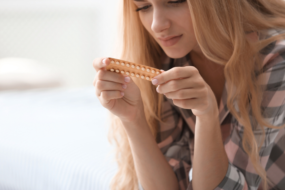 Young,Woman,With,Pills,At,Home.,Gynecology,Concept