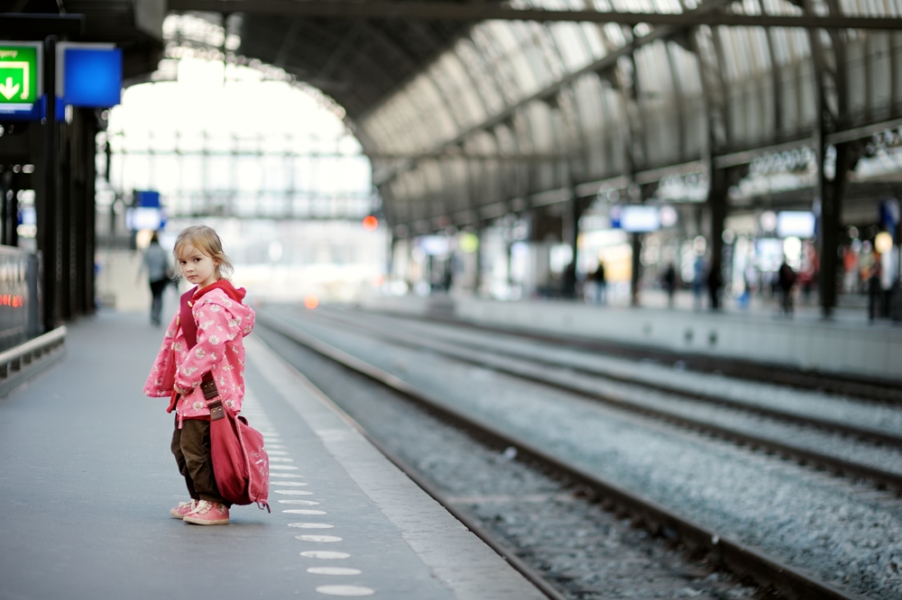 Cute,Little,Girl,With,Big,Shoulder,Bag,Standing,On,A