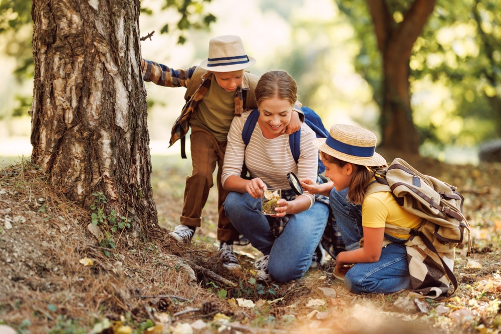 Happy,Family:,Two,Kids,Boy,And,Girl,With,Backpacks,Looking