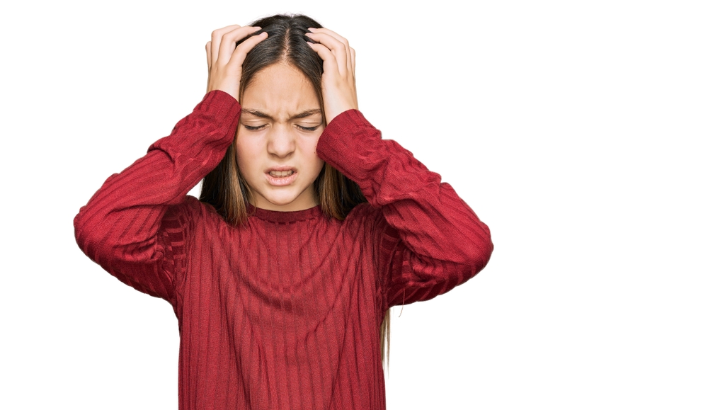 Beautiful,Brunette,Little,Girl,Wearing,Casual,Sweater,Suffering,From,Headache