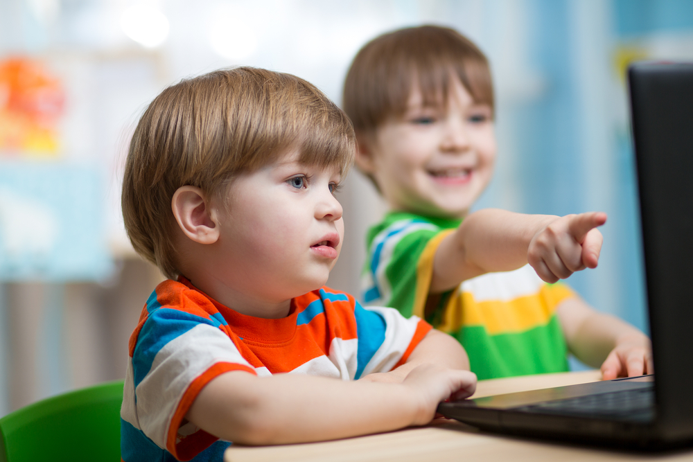 Happy,Children,Boys,Looking,At,Laptop,At,Home