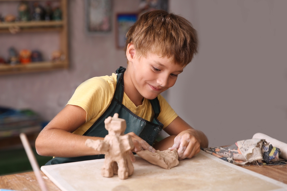 Kid,Sculpts,Clay,Crafts,Pottery,School.