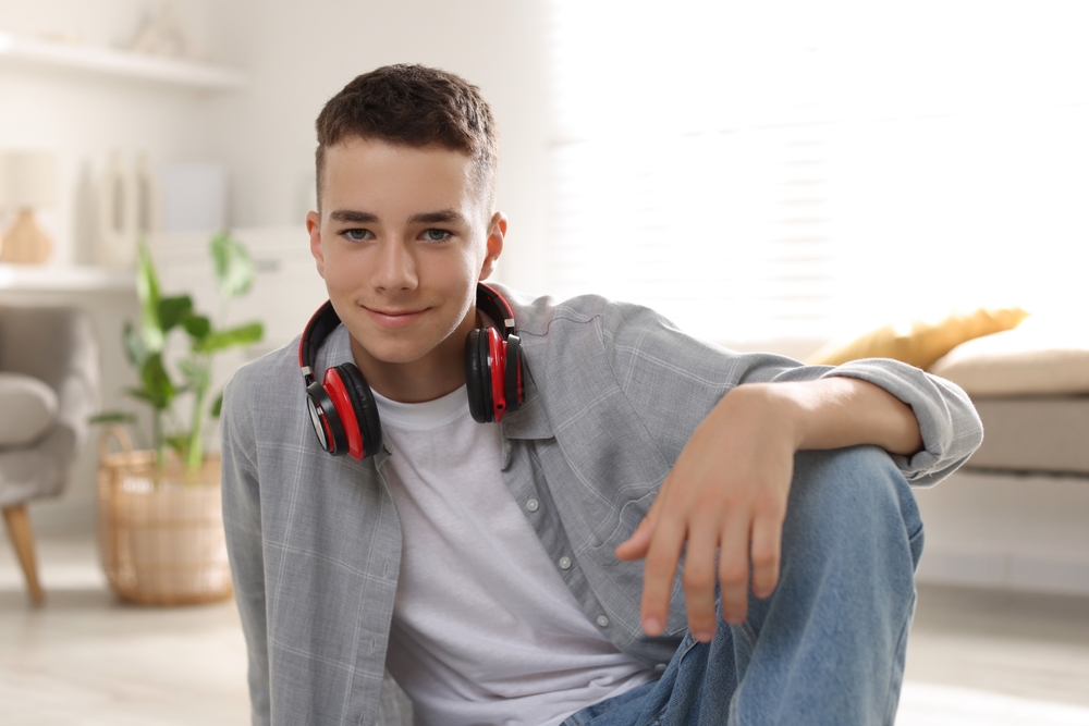 Portrait,Of,Teenage,Boy,With,Headphones,At,Home